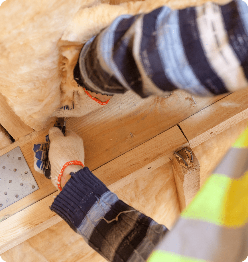 Close-up of contractor performing an insulation installation in Tigard, OR.