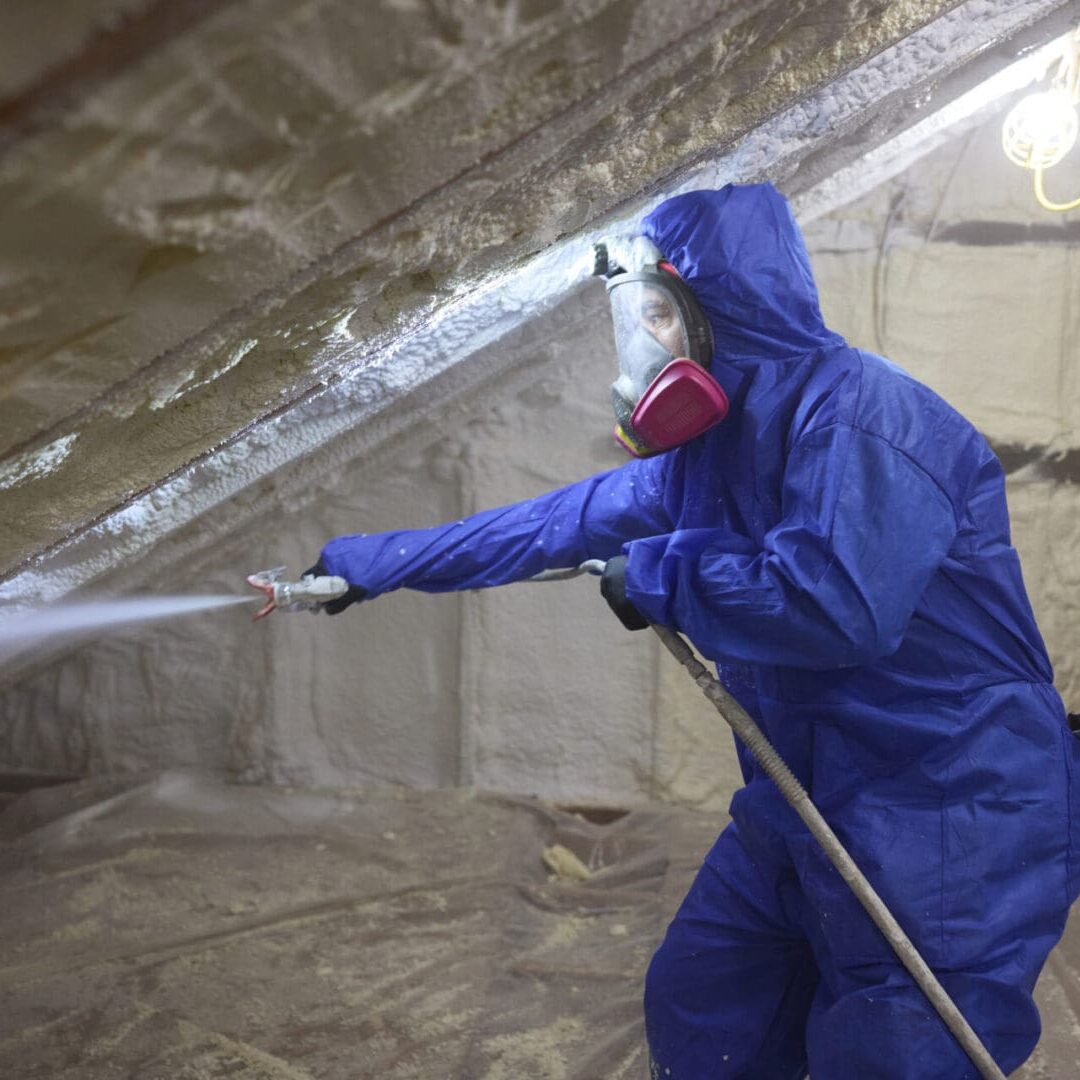 Professional technician performing a home energy evaluation in Eugene, OR.